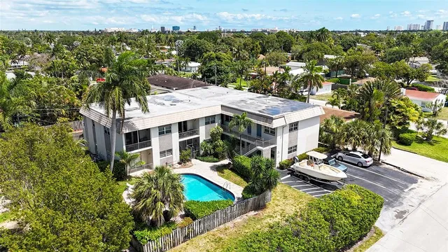 a backyard of a house with outdoor seating