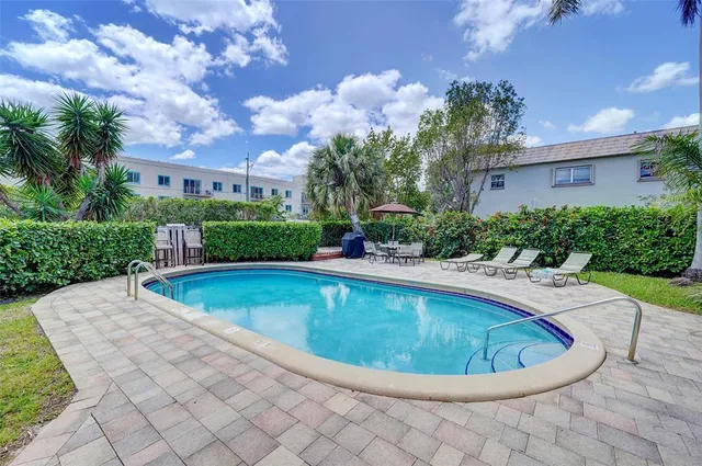 a view of a swimming pool with a patio