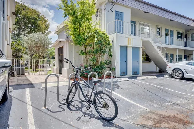 a view of a patio with furniture and a garden