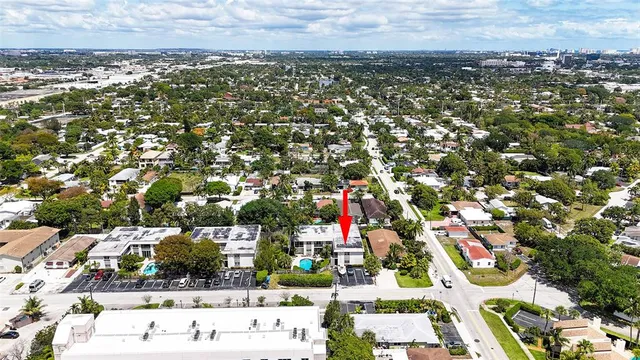 a view of a patio with couches table and chairs and potted plants