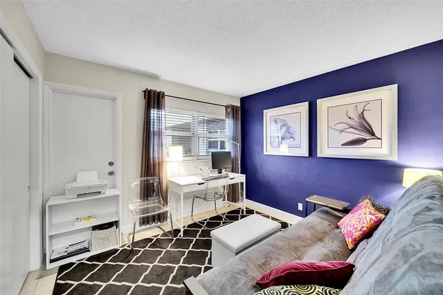 a bedroom with furniture and a window