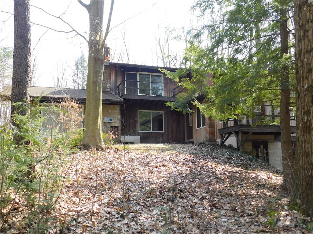 223 Tower Road Jamestown, PA 16134 - Photo 2 of 25 SIDE VIEW OF HOME AS YOU TRAVEL UP THE DRIVEWAY/DECK OVERLOOKS THE WATERFALL