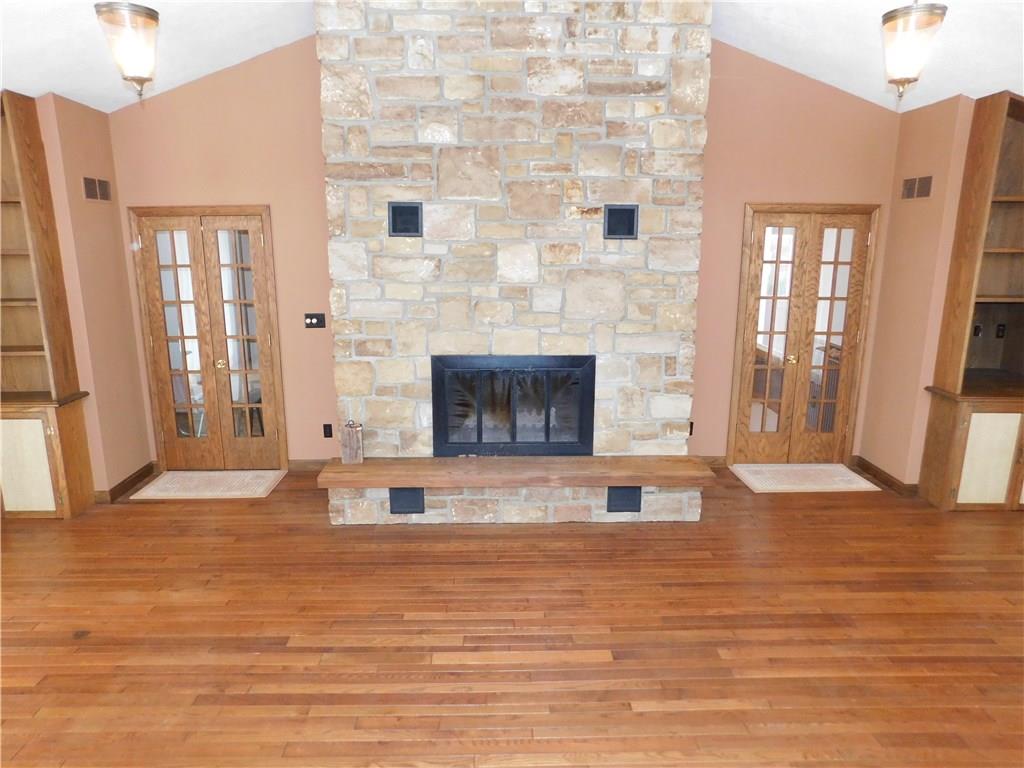 223 Tower Road Jamestown, PA 16134 - Photo 17 of 25 STONE FIREPLACE, FRENCH DOORS, HARDWOOD FLOORING, VAULTED CEILING IN L.R.