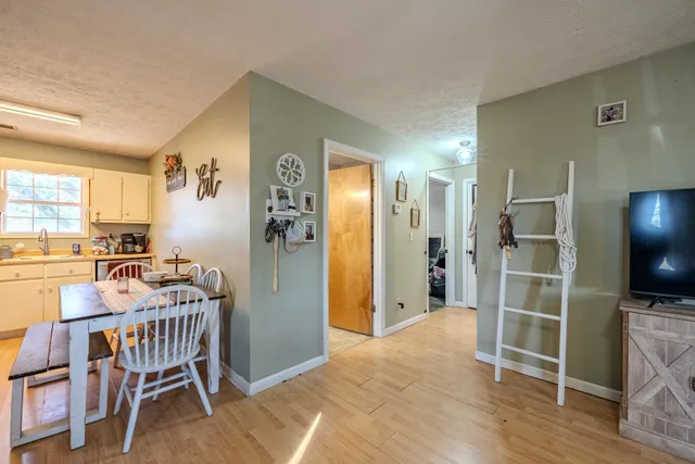 a view of a kitchen and dining room