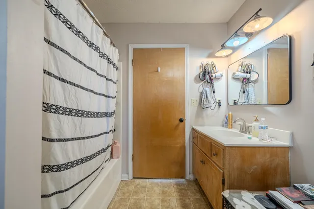 a bathroom with a sink and a mirror