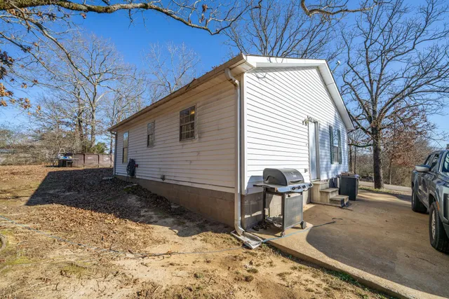 a view of a backyard with sitting area