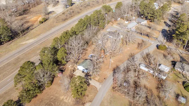 a view of a yard with snow on the road