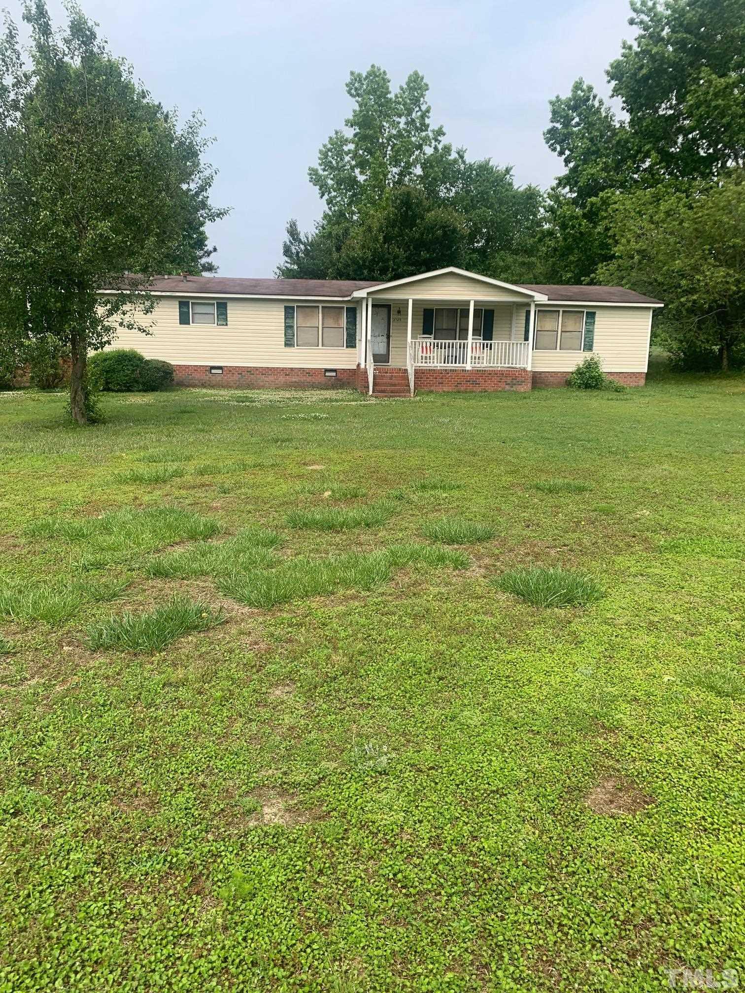 3125 Lizard Lick Road Wendell, NC 27591 - Photo 1 of 4 a view of a house with a yard