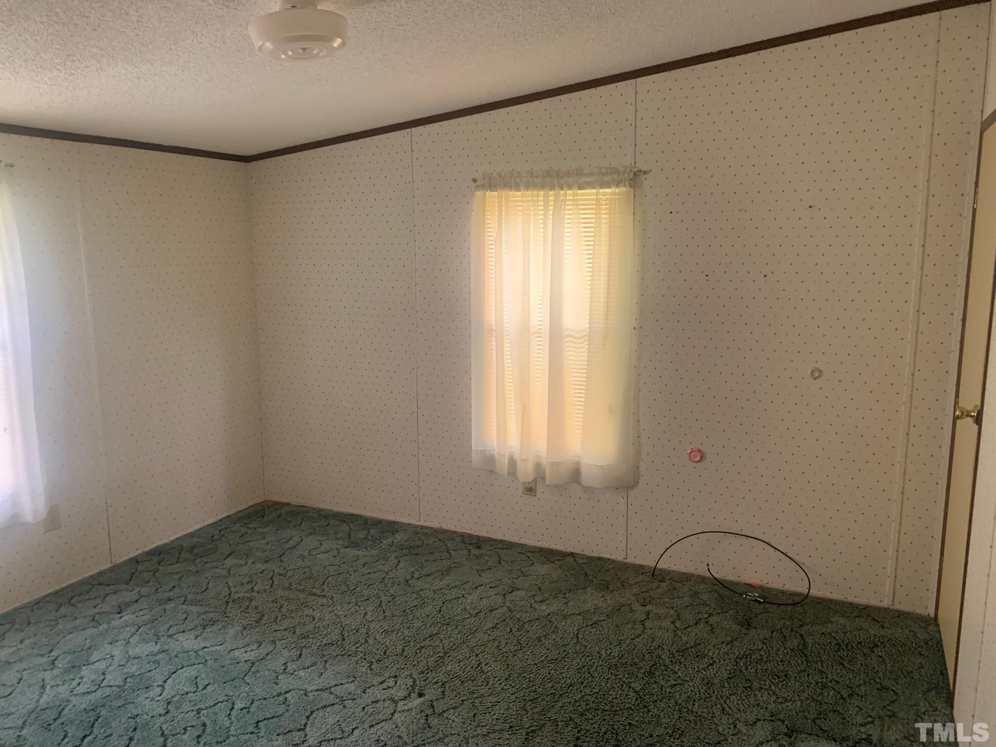 3125 Lizard Lick Road Wendell, NC 27591 - Photo 2 of 4 a room with a window
