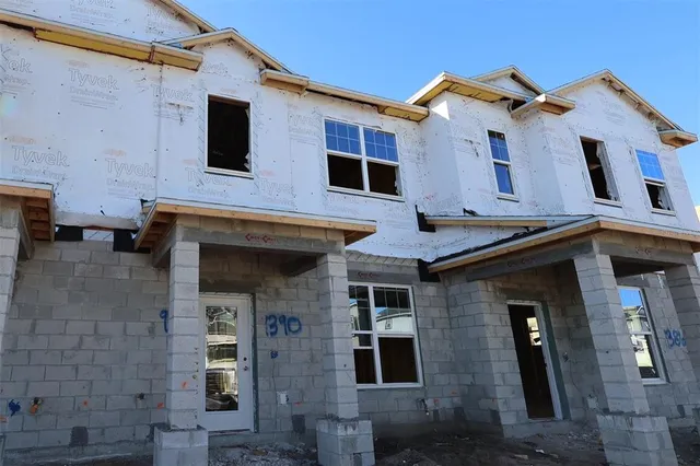 a front view of a house with garage