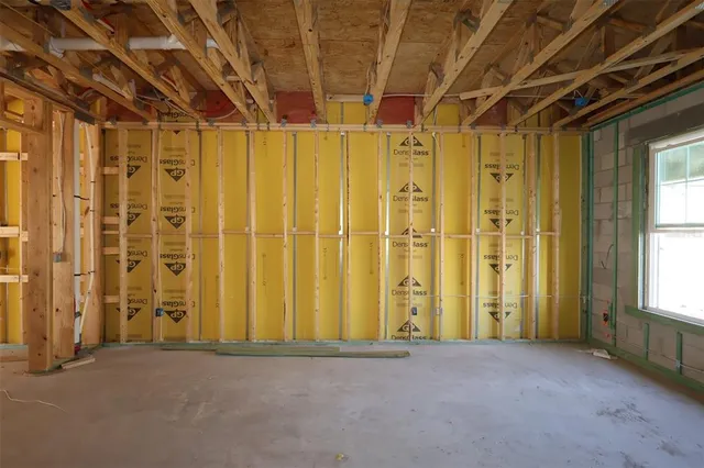 a view of a brick house with a large window