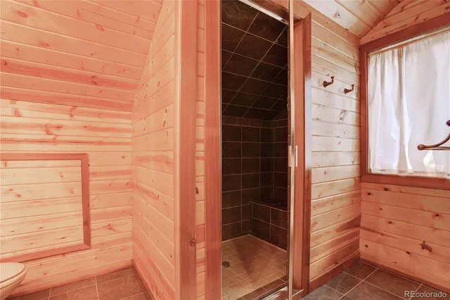 a view of a patio with couches chairs and a fire pit