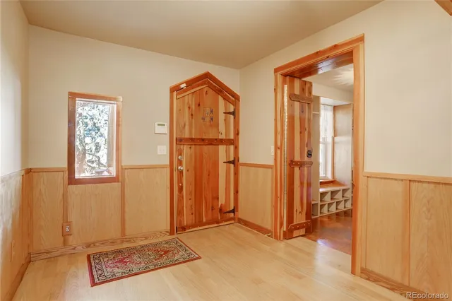 an empty room with windows and closet