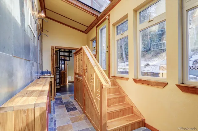 a view of staircase with large windows