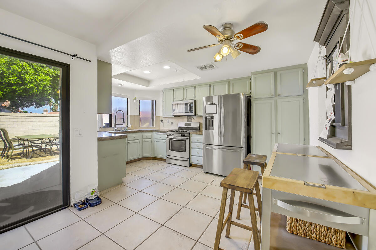 45535 Indian River Road Indio, CA 92201 - Photo 13 of 29 a kitchen with stainless steel appliances granite countertop a refrigerator sink and stove