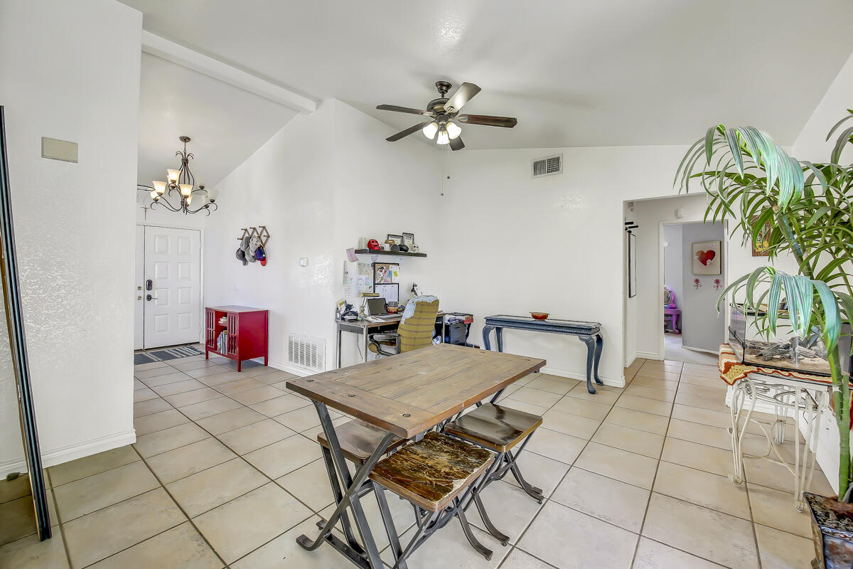 45535 Indian River Road Indio, CA 92201 - Photo 14 of 29 a living room with patio furniture and a chandelier
