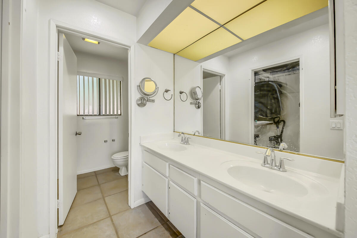 45535 Indian River Road Indio, CA 92201 - Photo 18 of 29 a spacious bathroom with a sink and a mirror