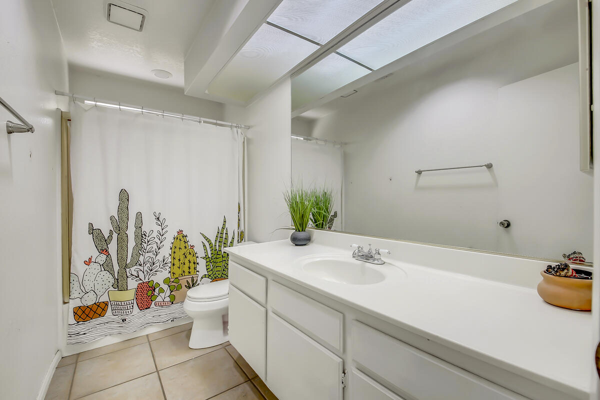 45535 Indian River Road Indio, CA 92201 - Photo 22 of 29 a bathroom with a sink a mirror and a toilet