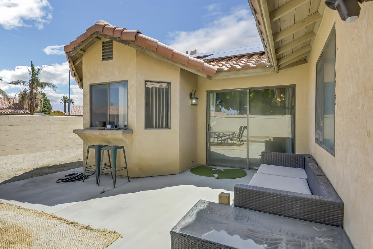 45535 Indian River Road Indio, CA 92201 - Photo 24 of 29 a front view of a house with garden