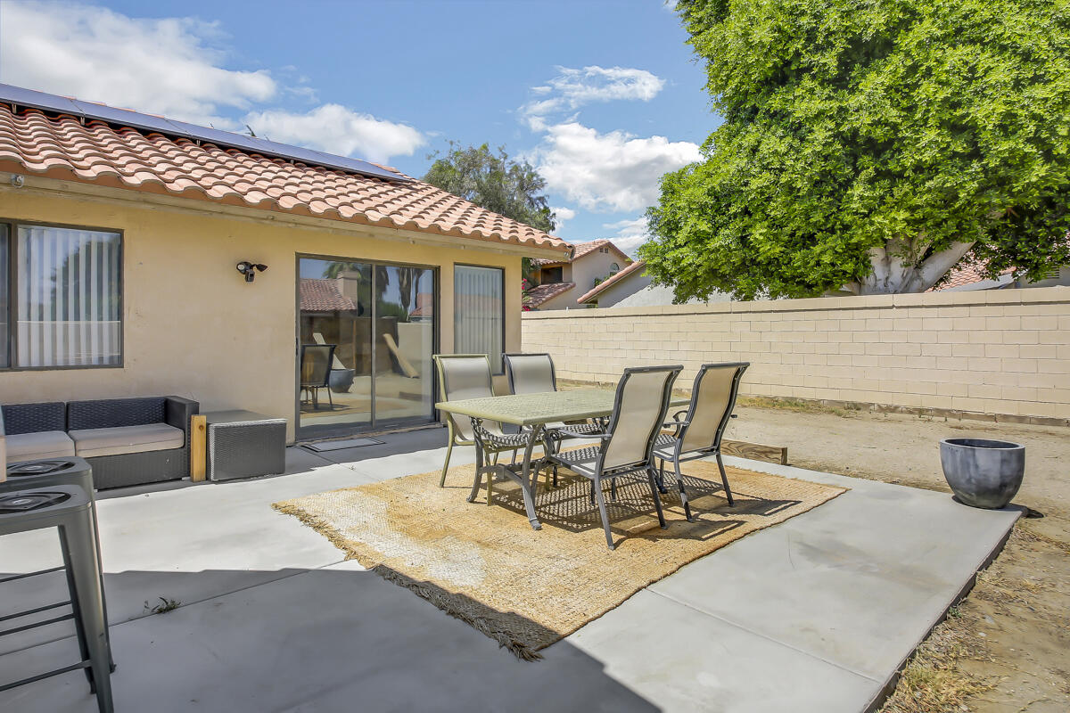45535 Indian River Road Indio, CA 92201 - Photo 25 of 29 a view of a patio with table and chairs and potted plants