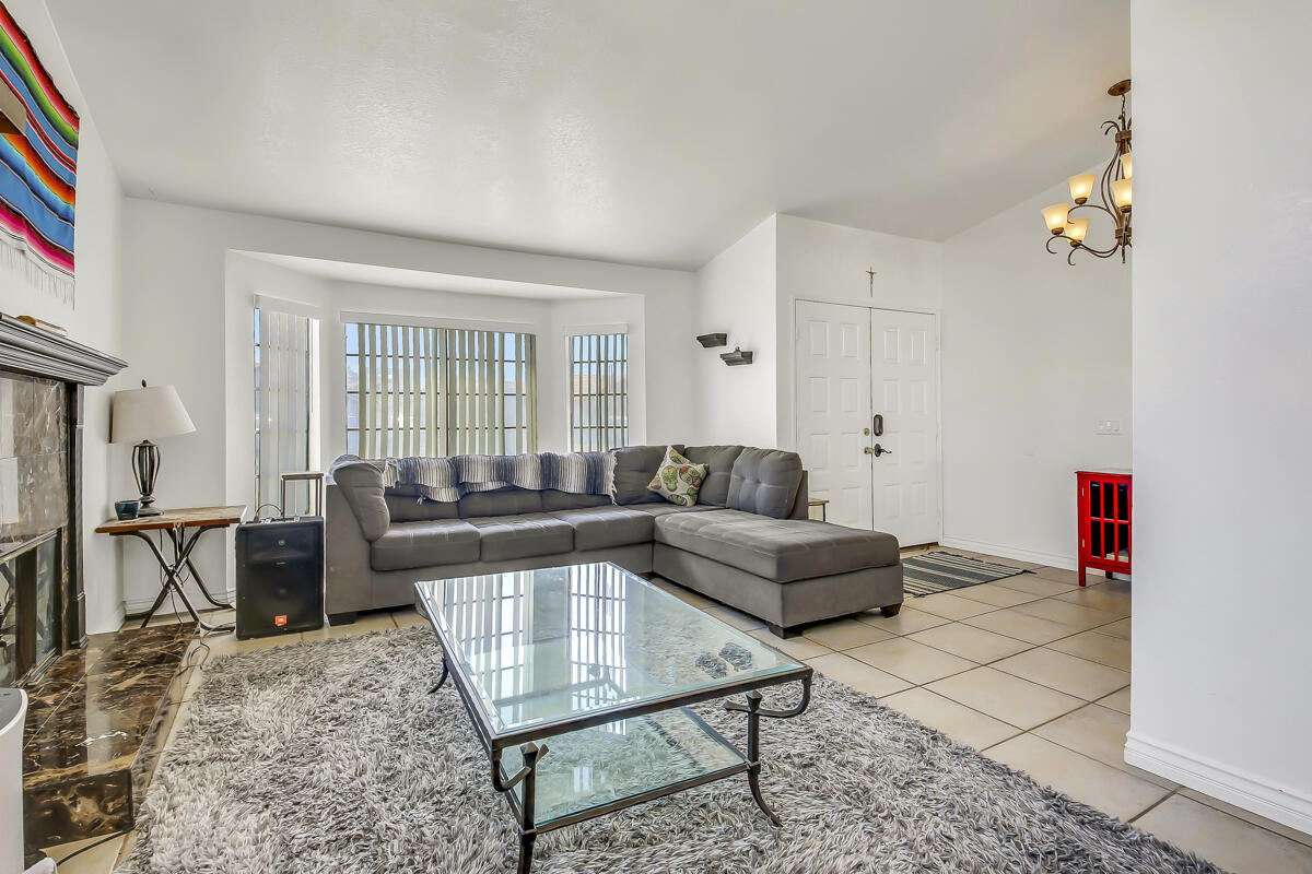 45535 Indian River Road Indio, CA 92201 - Photo 5 of 29 a living room with furniture a dining table and a piano table