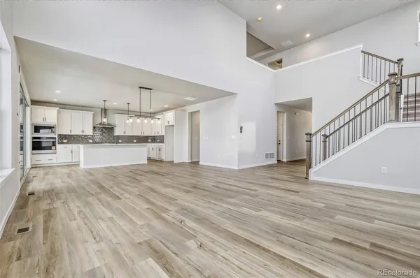 a view of kitchen with wooden floor