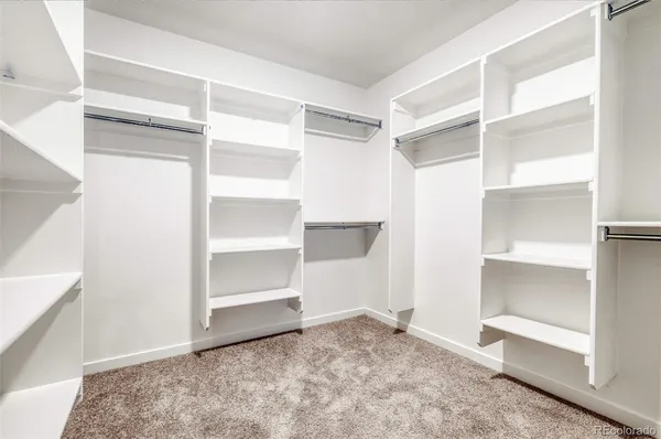 a view of an empty walk in closet