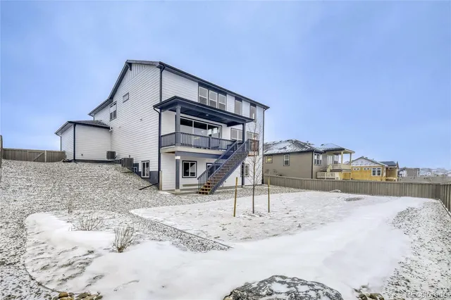 a view of a house with a snow in the background