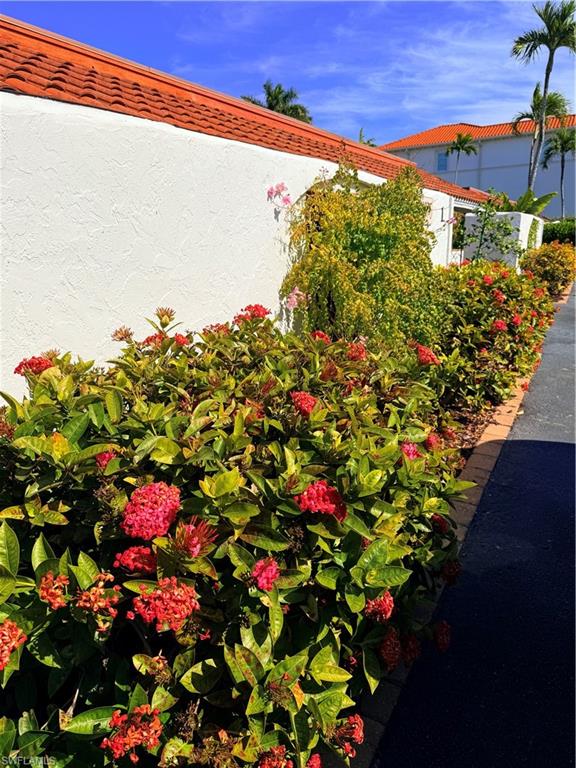 1575 Curlew Avenue, Unit 1 Naples, FL 34102 - Photo 12 of 35 Beautiful plants on site of 1 story building with only 4 units