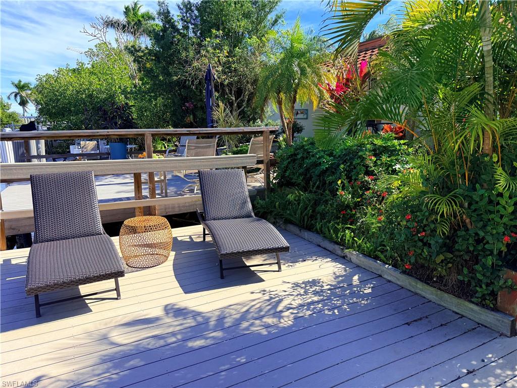 1575 Curlew Avenue, Unit 1 Naples, FL 34102 - Photo 2 of 35 View of deck with electric boat lift
