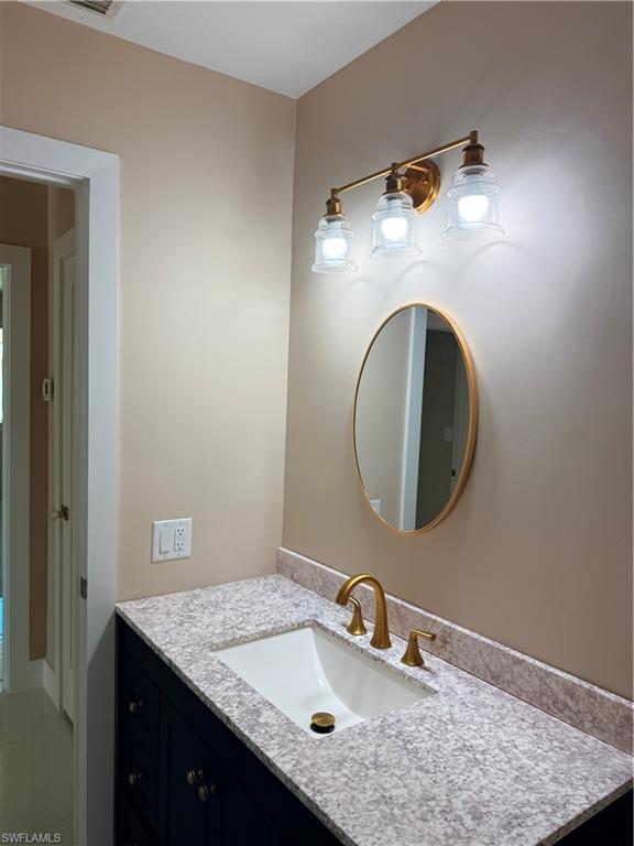 1575 Curlew Avenue, Unit 1 Naples, FL 34102 - Photo 26 of 35 Guest Bathroom with vanity