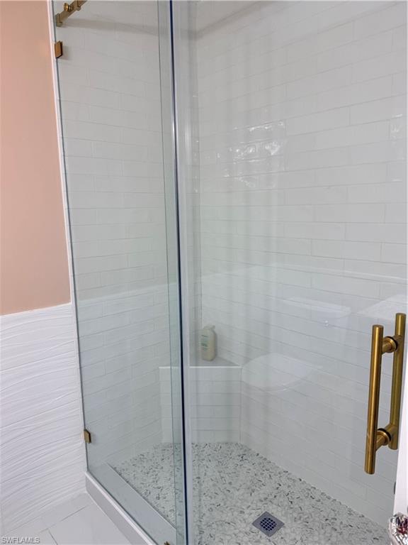 1575 Curlew Avenue, Unit 1 Naples, FL 34102 - Photo 27 of 35 Guest Full bath featuring a stall shower