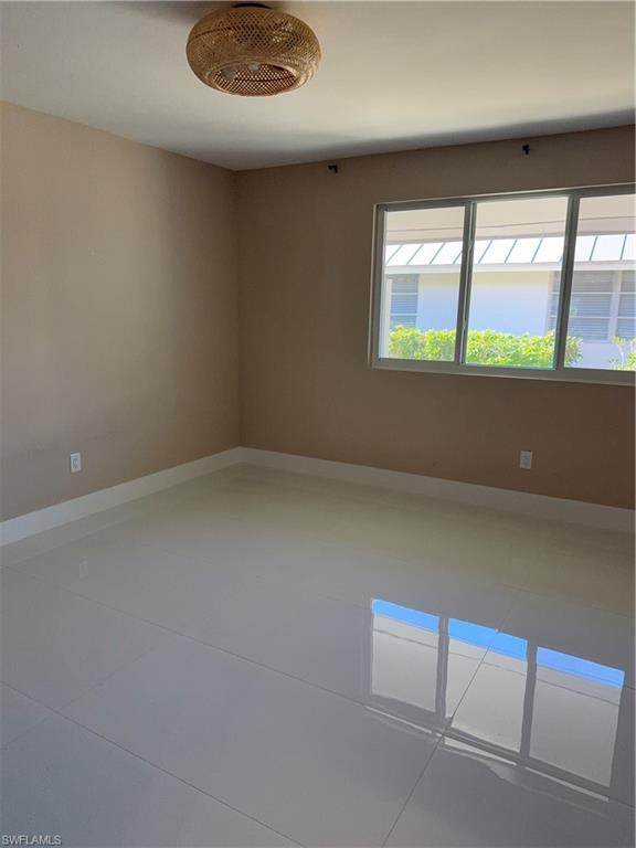 1575 Curlew Avenue, Unit 1 Naples, FL 34102 - Photo 29 of 35 Primary bedroom with complete privacy room for kingsize bed and more