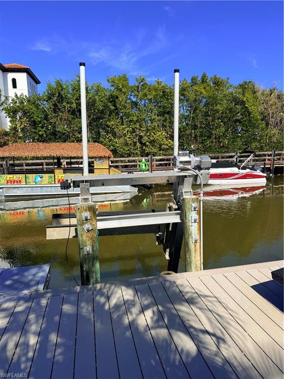 1575 Curlew Avenue, Unit 1 Naples, FL 34102 - Photo 9 of 35 Dock area with a water view looking at Naples Bay resort and boats