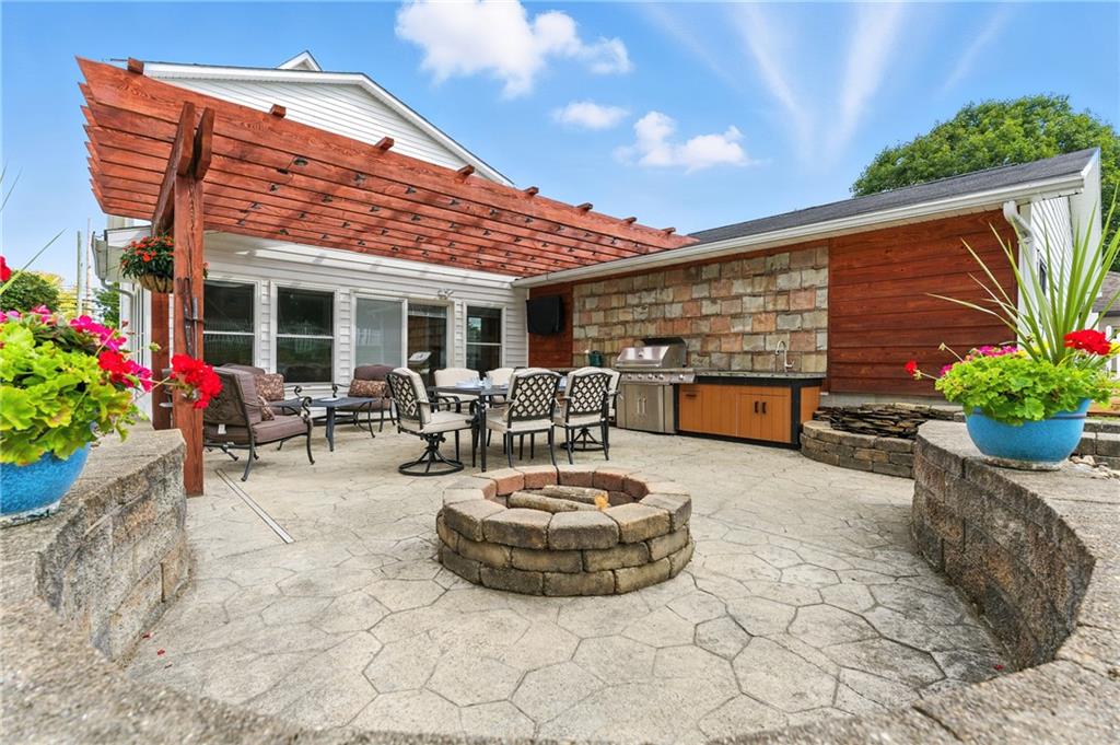 519 West Ridge Avenue Sharpsville, PA 16150 - Photo 42 of 48 a view of a patio with a table and chairs potted plants