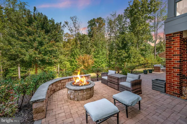 a front view of a house with outdoor seating