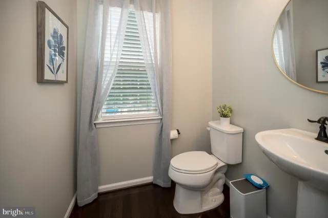 a view of kitchen island with furniture and wooden floor