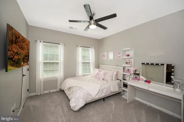 a view of a big yard with swimming pool and green space