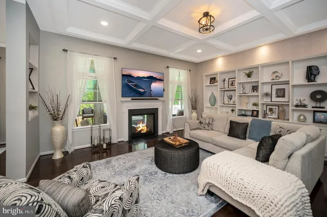 a kitchen with stainless steel appliances granite countertop a sink a stove and a wooden cabinets