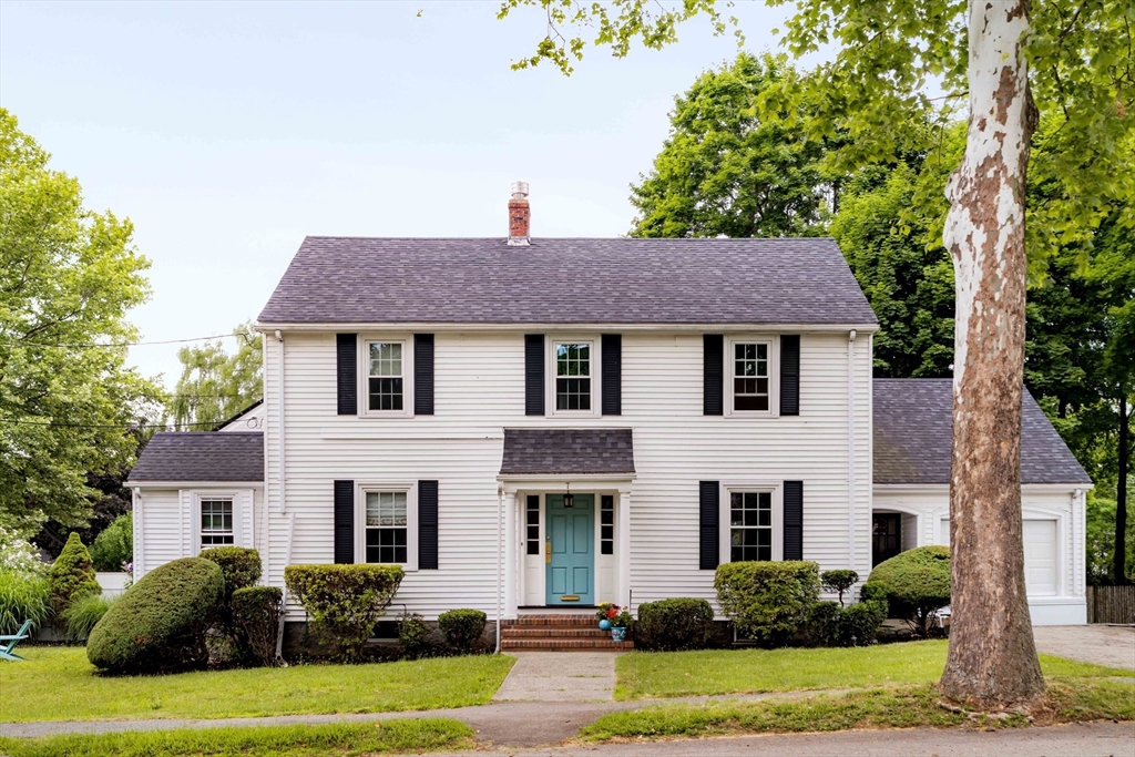 7 St Marys Road Milton, MA 02186 - Photo 1 of 31 a front view of a house with a yard and garage
