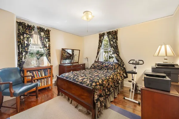 a bedroom with furniture and a window