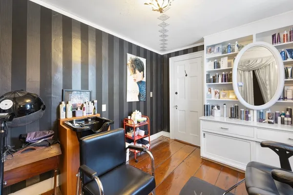 a work room with furniture and musical instruments