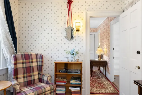 a bathroom with a toilet and a shower curtain