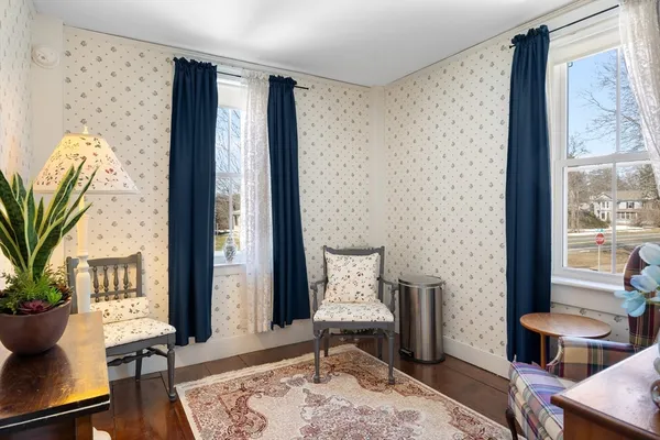 a bedroom with furniture and a window