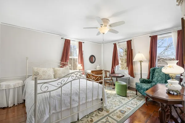 a bedroom with furniture and a window