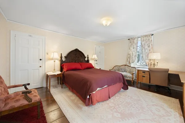 a bedroom with a bed and dresser