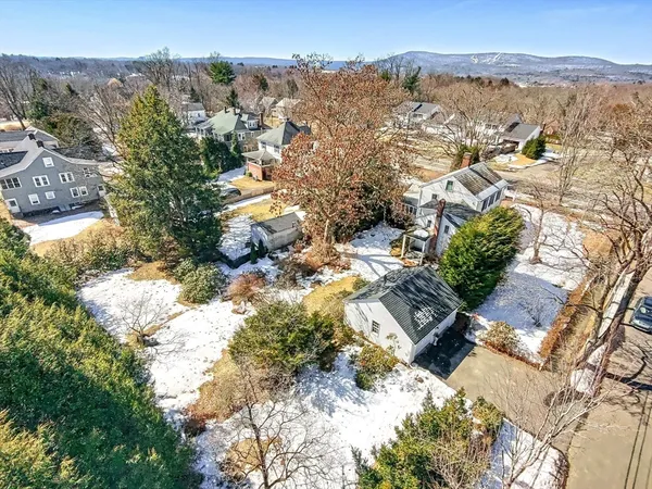 an aerial view of residential house with parking space