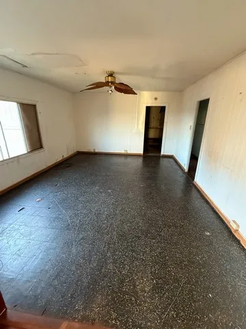 a view of a livingroom with furniture and window