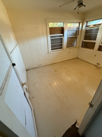 4873 A Alii Road Hanapepe, HI 96716 - Photo 8 of 13 a view of an empty room with a window