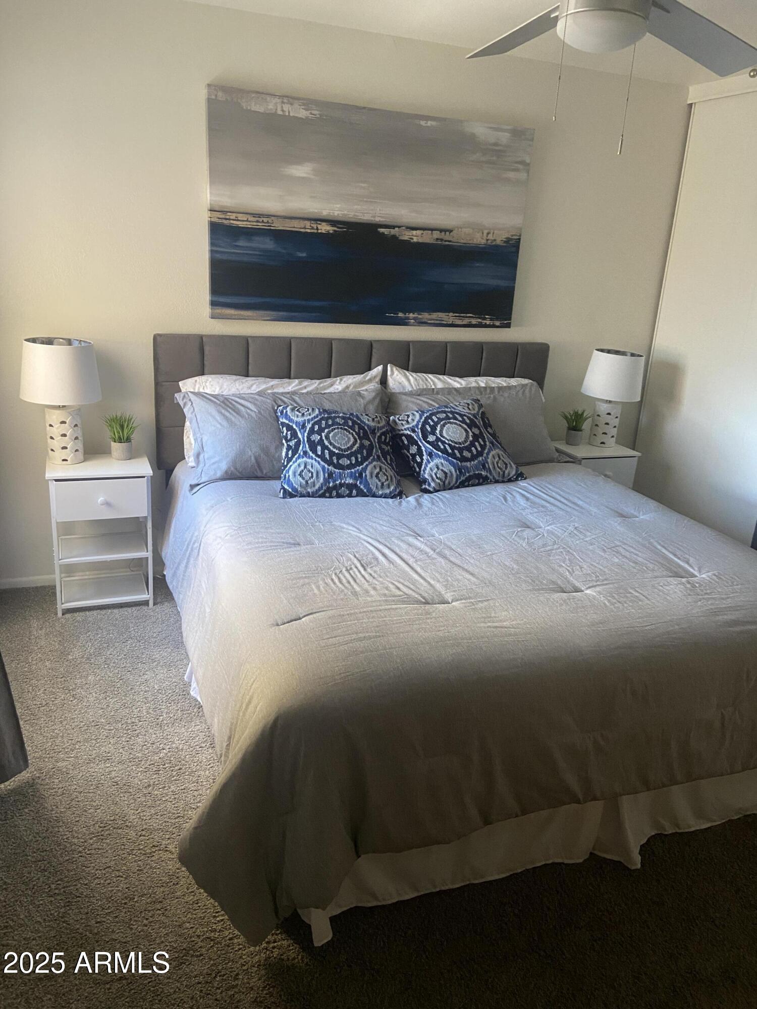 8055 East Thomas Road, Unit A303 Scottsdale, AZ 85251 - Photo 12 of 25 a bedroom with a bed and window